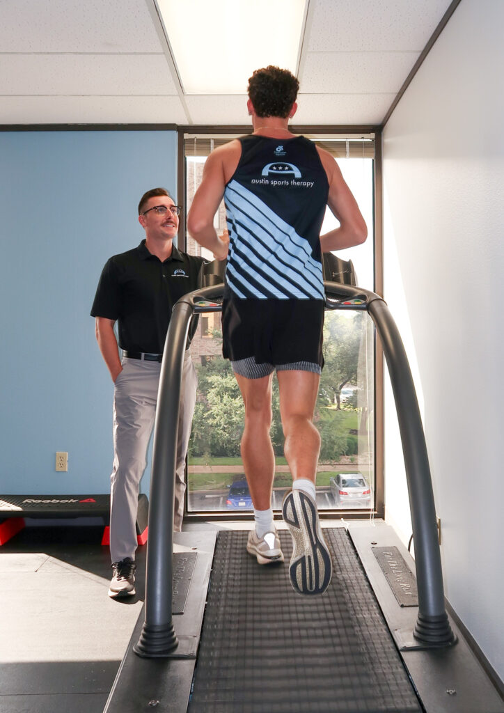 Doctor Carter watching patient run on Treadmill